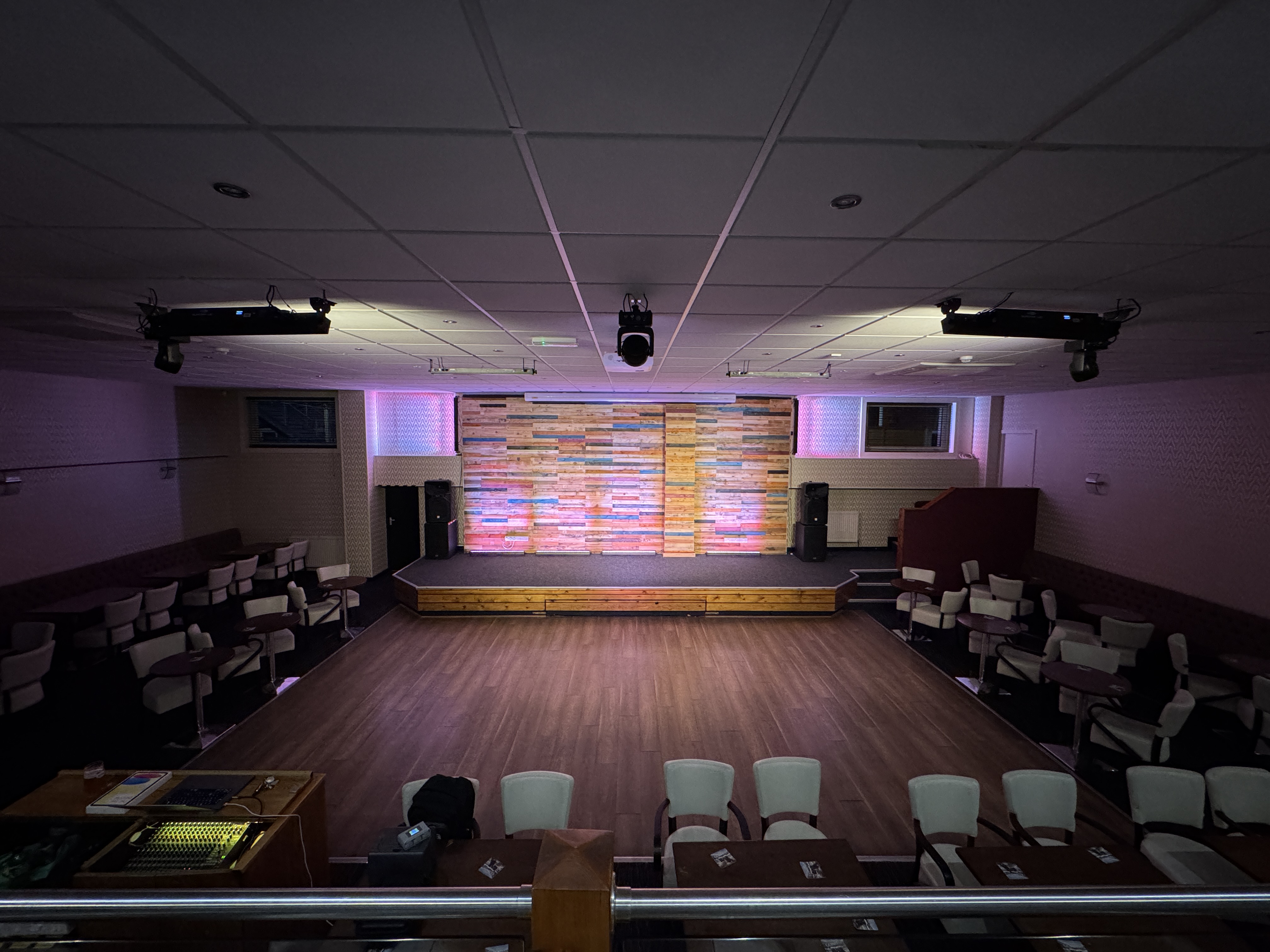 Two Showtec Sunstrip LED Tungsten Blinders providing warm stage-forward house lighting